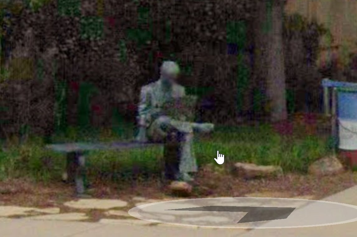 Man Reading Newspaper Statue